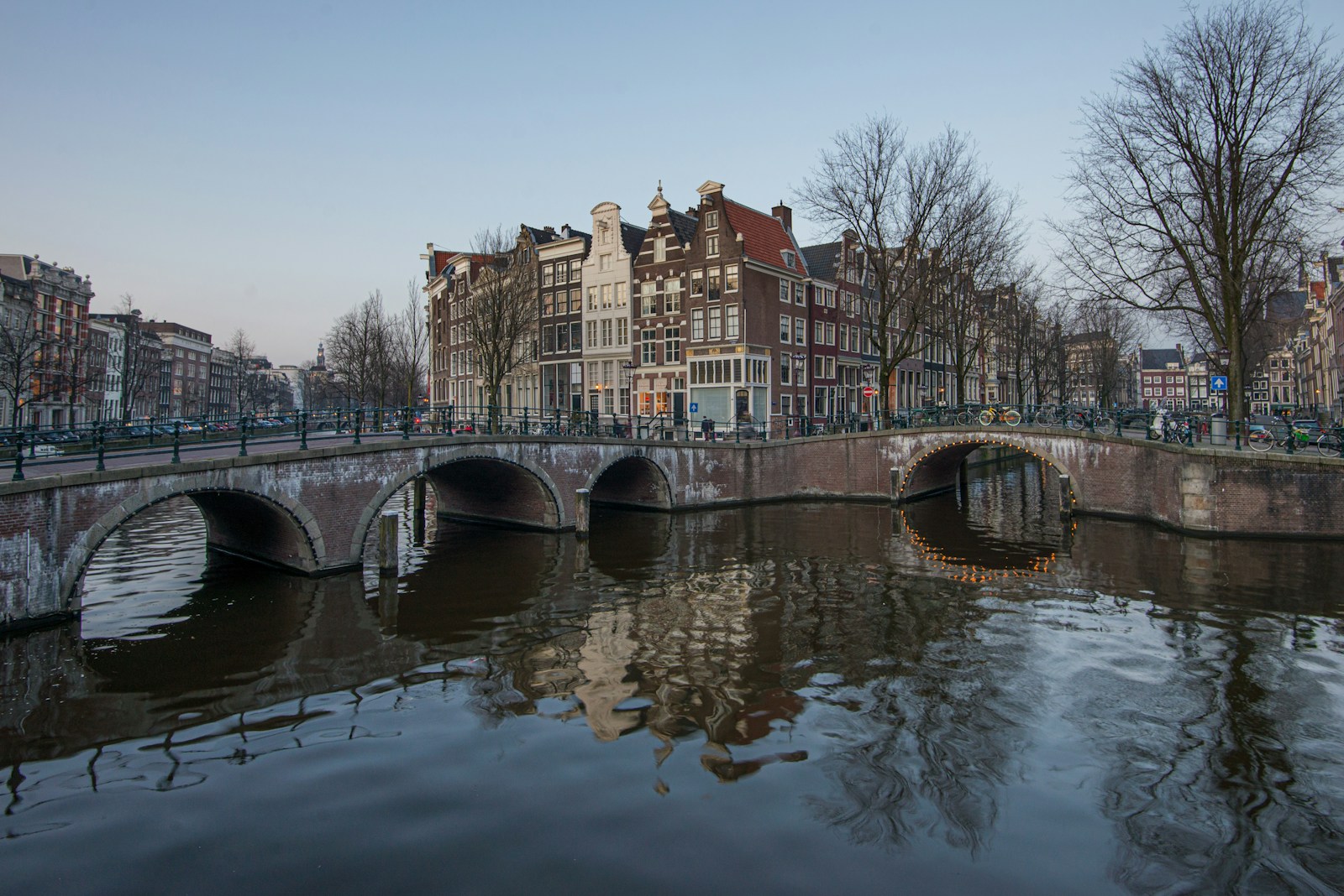 a bridge over a body of water in a city